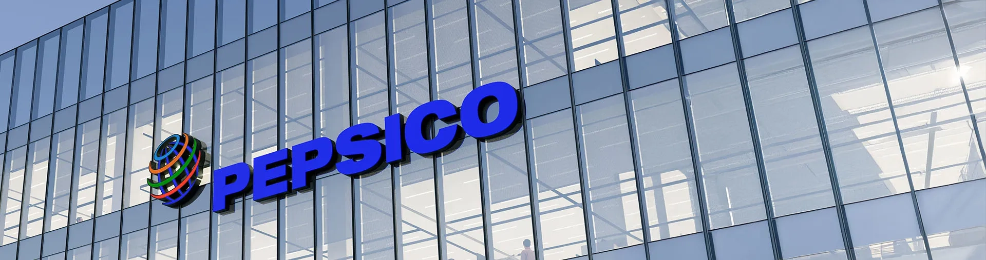 Photo du Siège de PepsiCo avec logo sur bâtiment vitré.