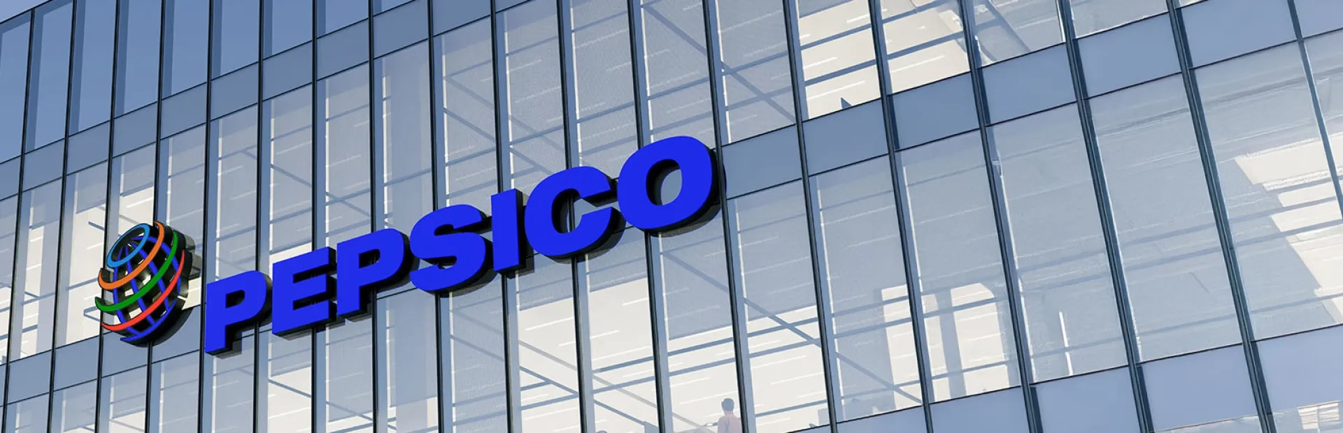 Photo du Siège de PepsiCo avec logo sur bâtiment vitré.